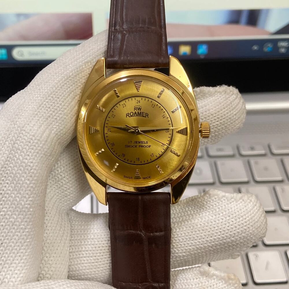 Vintage 1985 Roamer Manual Mens Gold Watch W/Leather Strap & Gold accents